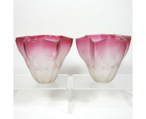 A pair of pink and clear glass lamp shades, with etched decoration, 3cm fitting (2)Both are dirty with light surface marks. T