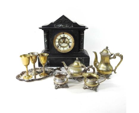 A silver plated tea service, together with a Victorian black slate mantle clock, 31 x 32hcm