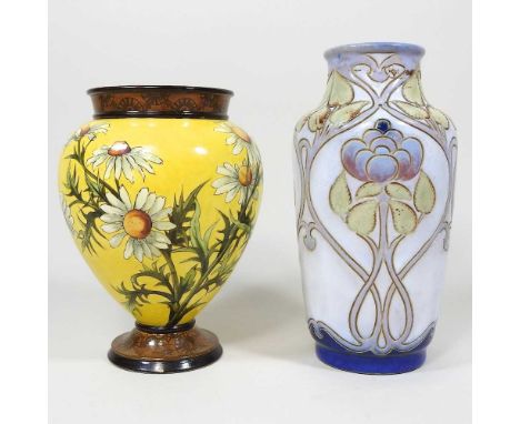 A late 19th century Doulton Lambeth Faience pottery vase, painted with flowers on a yellow ground, printed impressed and mono