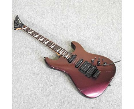 A vintage 1988 Charvel model 4 red electric guitar, made in Japan