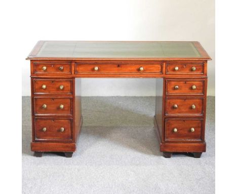 A Victorian mahogany pedestal desk, with a green inset writing surface and containing nine short drawers133w x 69d x 76h cmOv