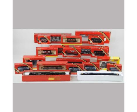 A collection of Hornby OO gauge toy trains, mostly boxed, to include carriages and model vehicles
