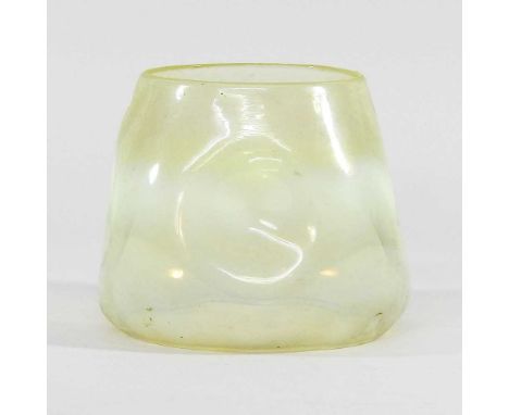 An Arts and Crafts green vaseline glass oil lamp shade, of dimpled form, aperture 12cmChip to rim.
