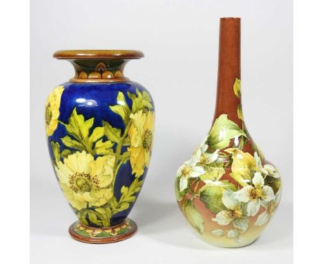 A late 19th century Doulton Lambeth Faience pottery vase, of bottle shape, painted with flowers, printed marks to base, 27cm 