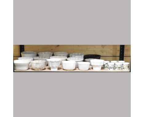 A collection of early 20th century and later white glazed pottery jelly moulds, together with a Portmeirion coffee set