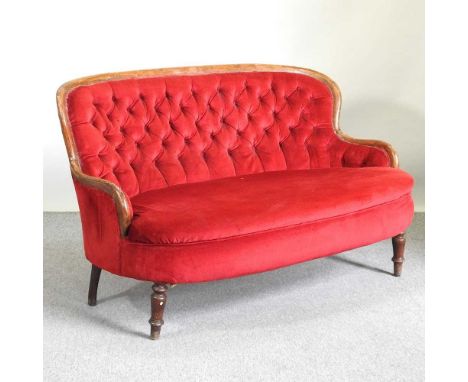 A Victorian red upholstered button back sofa, on turned legs, together with an antique iron bound trunk (2)151w x 87d x 91h c