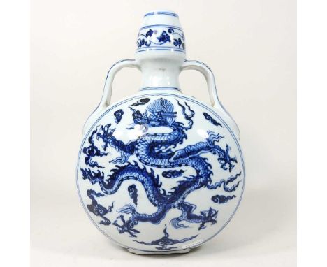 A modern Chinese blue and white glazed vase, of moon flask design, 29cm high