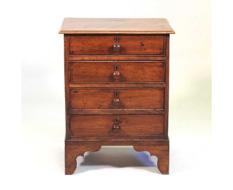 A George III mahogany chest, of small proportions, containing four long drawers, on bracket feet55w x 42d x 93h cm