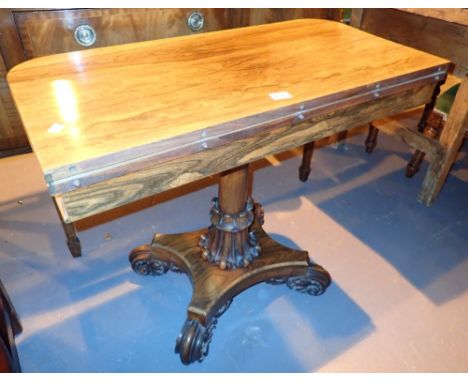 Good rosewood foldover card table on heavily carved pedestal supports