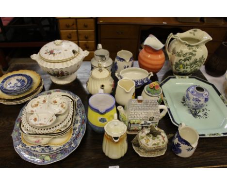 A quantity of various jugs; a novelty teapot; a soup tureen and cover etc.