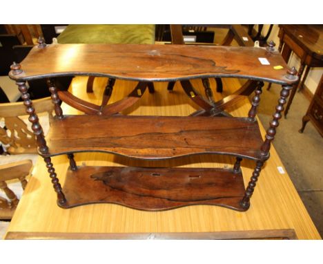 A Victorian rosewood three tier wall shelf