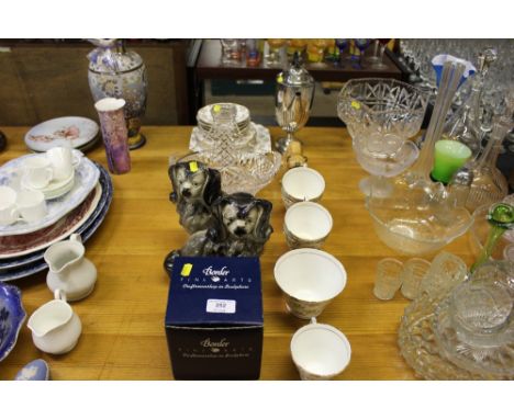 A silver plated coffee pot; a cut glass basket; two Staffordshire style dogs; teaware etc.