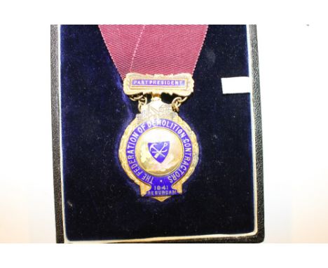 A silver gilt and enamel decorated Federation Of Demolition Contractors medal in fitted case