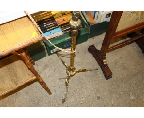 A brass barley twist standard lamp and shade
