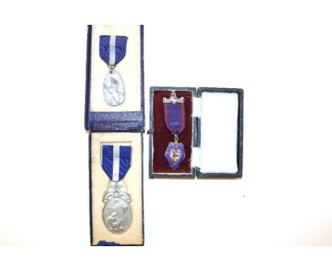 Two Masonic medals and a silver and enamelled Oddfellows medal, each in fitted cases