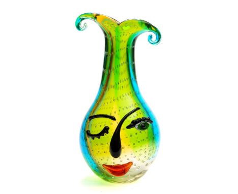 *Mario Badioli (b.1940) a Murano glass 'face vase': of tear drop form with bifurcated and scrolling neck, the amber, green an