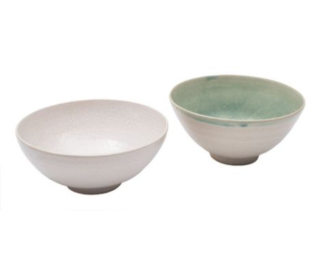 *Anya Coper (Contemporary) two stoneware bowls: of circular footed form, one under white glazes, the other with pale green in