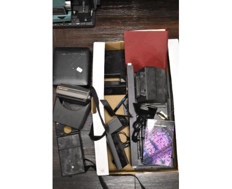 A selection of Polaroid camera equipment including a microscope addaptor