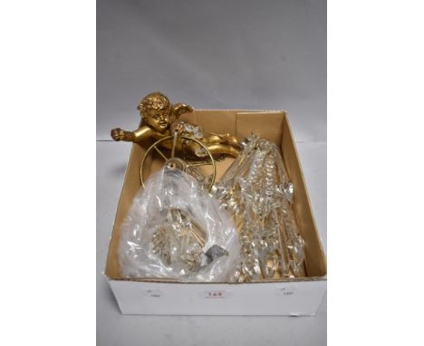 A 20th century light fitting of a cherub holding a lustre shade