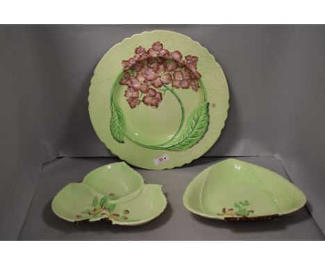 Three 20th century Carlton ware dishes two in the form of leaf in the Australian design and a larger plate AF