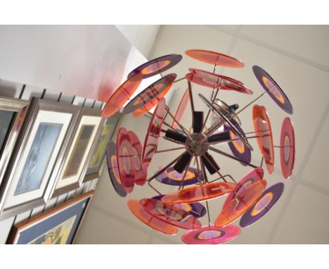 A vintage mid century Lollipop style pendant light having acrylic glitter shades