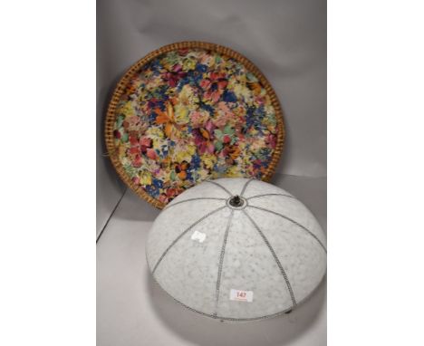An early 20th century fibre woven basket with cloth lining and an Art Deco glass fly catcher light shade