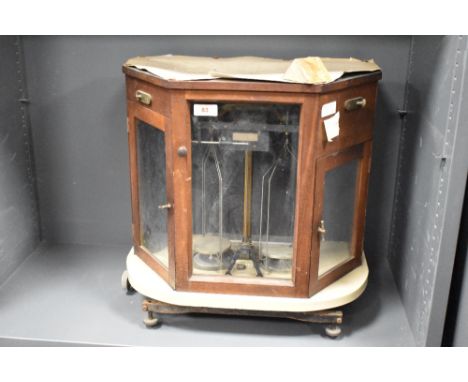 A cased set of laboratory scales
