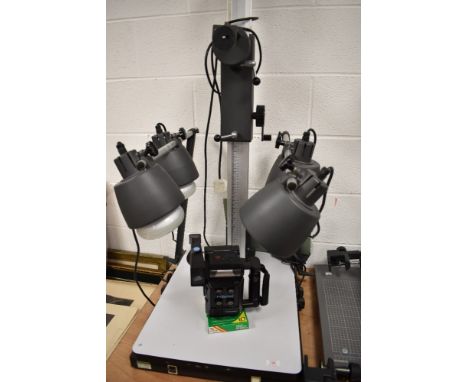 A Polaroid Miniportant camera with a Polaroid MP4 Land Camera focus stand