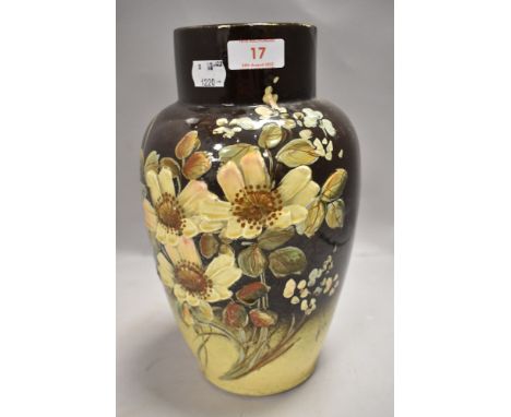 A Victorian aesthetic period ceramic vase hand decorated with flowers