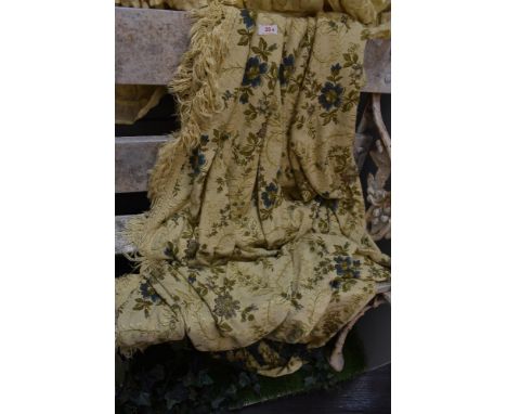 A vintage cruel work style bed throw having floral pattern