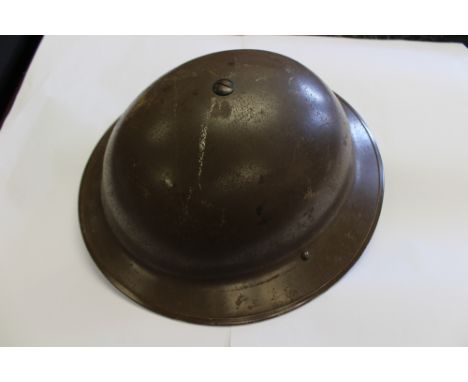 WW2 British MKII steel helmet. Shell made by HBS and dated 1939, Smooth brown paint. Early pattern liner by Helmets Ltd size 