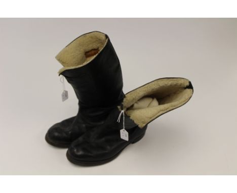 Pair of vintage black leather sheepkin lined flying boots with leather soles with overlaid rubber Avon marked soles and heels