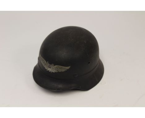 Third Reich Beaded Luftschutz M40 Stalhelm steel helmet. Original paint with Luftschutz decal to front. Shell marked "Q64". L