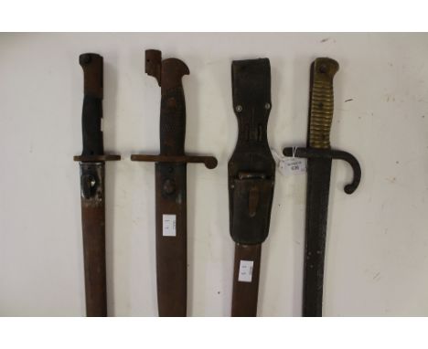 British Brown Bess bayonet (no scabbard) French Chasspot bayonet (no scabbard) Mauser bayonet and scabbard, K98 scabbard and 