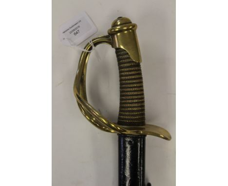 French 1882 pattern Light Cavalry sword and scabbard. Brass hilt with a three bar guard, the grip is horn and bound with bras