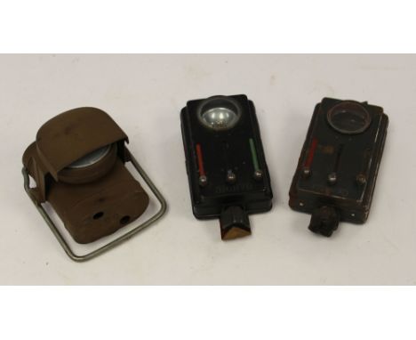 WW2 Flashlights: two German by Daimon one in black paint in good order and one in field grey paint missing reflector and bulb