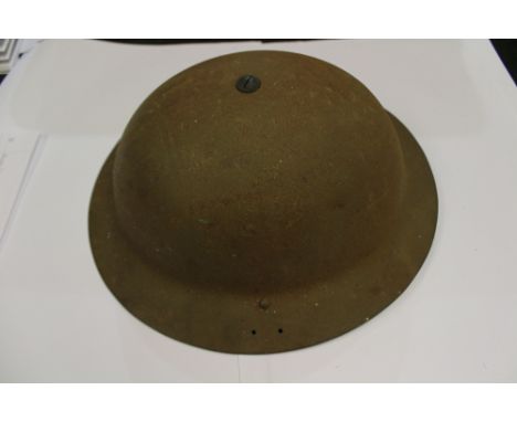 WW2 British Home Guard Steel helmet. Size 7. Liner dated 1940. Complete with liner and chinstrap. Shell marked 1941 LG and Co