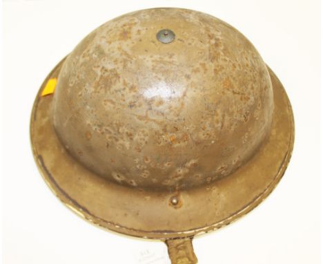 WW2 British Mark II steel helmet. Smooth brown original paint with very faint "CRAF" stenciled to front. Complete with liner 