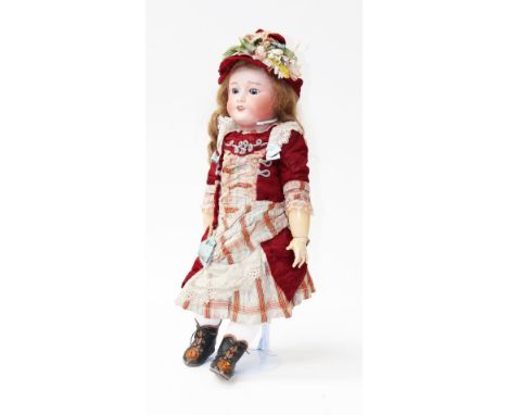 An early 20th Century bisque head doll, incised "FRANCE B.F.B.J. 301 PARIS 10" and indistinctly over stamped in red "TETE JUM