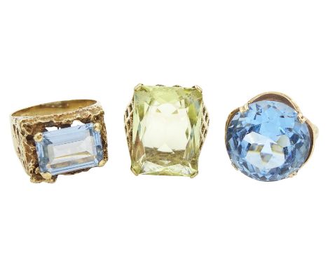 Gold blue emerald cut blue topaz ring, single stone green quartz ring and one other blue paste stone ring, all hallmarked 9ct