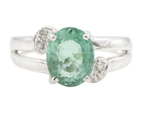 18ct white gold oval cut Paraiba tourmaline and round brilliant cut diamond ring, Birmingham 2006, tourmaline approx 1.80 car