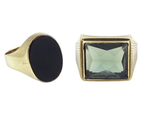 Gold oval black onyx signet ring and a green stone set signet ring, both 8ct, stamped 333Condition Report:8ct approx 9.6gm, g