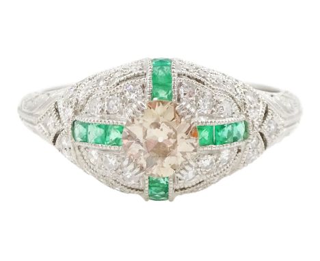 Platinum emerald and diamond ring, the principal transitional cut diamond of 0.41 carat, with milgrain set calibre cut emeral