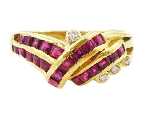 18ct gold channel set, calibre cut ruby and round brilliant cut diamond crossover ring, stamped 750Condition Report:Approx 3.