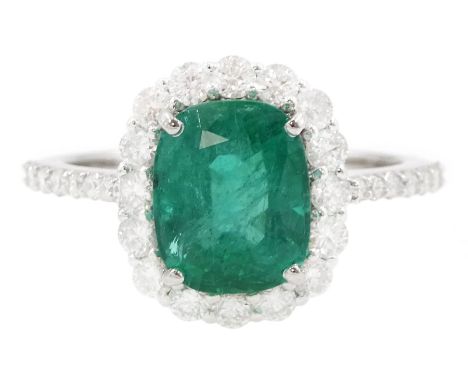 18ct white gold cushion cut emerald and round brilliant cut diamond cluster ring, with diamond set shoulders, stamped, emeral