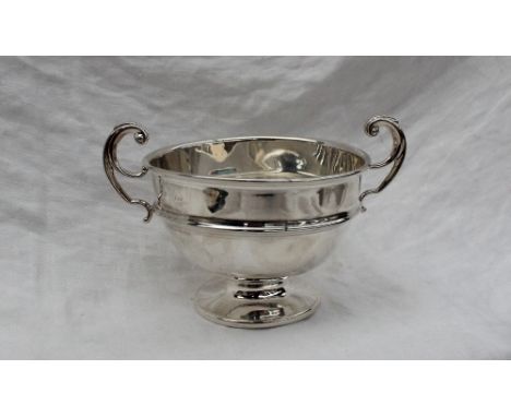 A George V silver twin handled sugar basin, with scrolling handles and a ring turned body on a spreading foot, Birmingham, 19