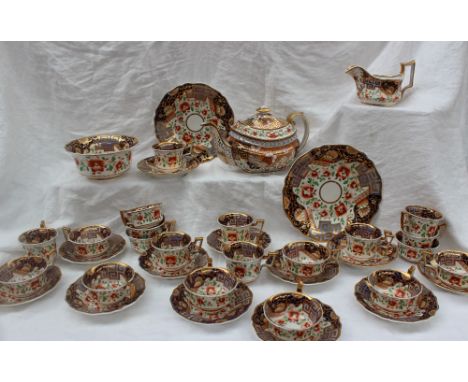 A 19th century English Imari pattern part tea and coffee service, 2/1073, comprising a tea pot, cream jug, tea cups, coffee c