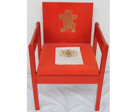 The Earl of Snowden and Carl Toms, a red painted beech and laminate elbow chair produced for the Investiture of the Prince of