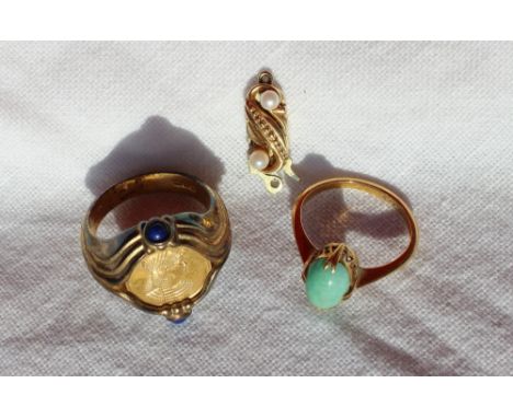 A 22ct yellow gold ring, set with a cabochon jade panel, approximately 2.9 grams together with a silver gilt Egyptian inspire