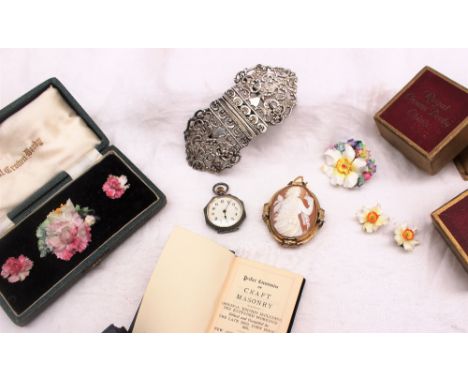 Royal Crown Derby floral brooch and matching earring, cased together with another Royal Crown Derby floral brooch and earring